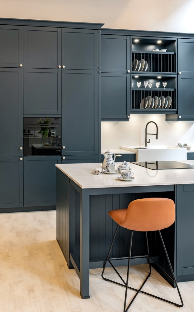 Beautiful modern gray kitchen with white counter top on kitchen island