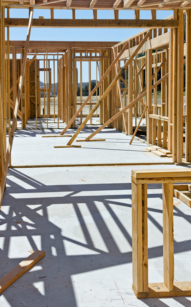 Wood,Frames,For,A,House,Are,Put,Up,And,Braced Wood frames for a house are put up and braced temporary.