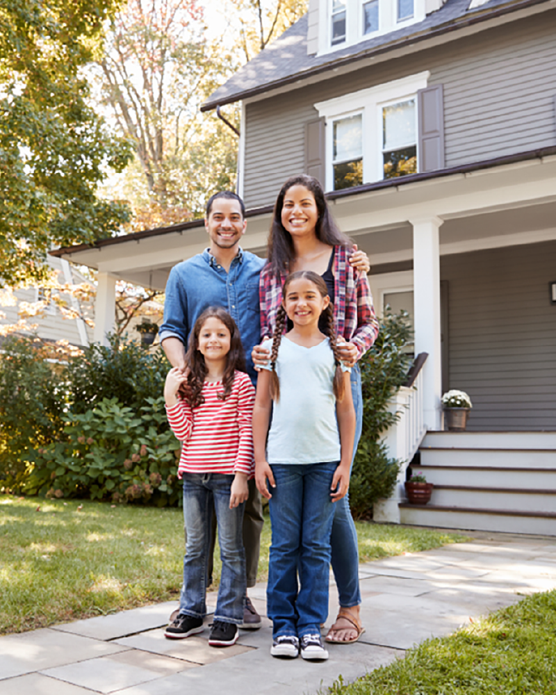 Bradford&Kent_family in front of house img