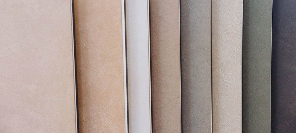 Ceramic tile samples showcasing a range of earth tones and textures for flooring and wall covering in residential and commercial spaces